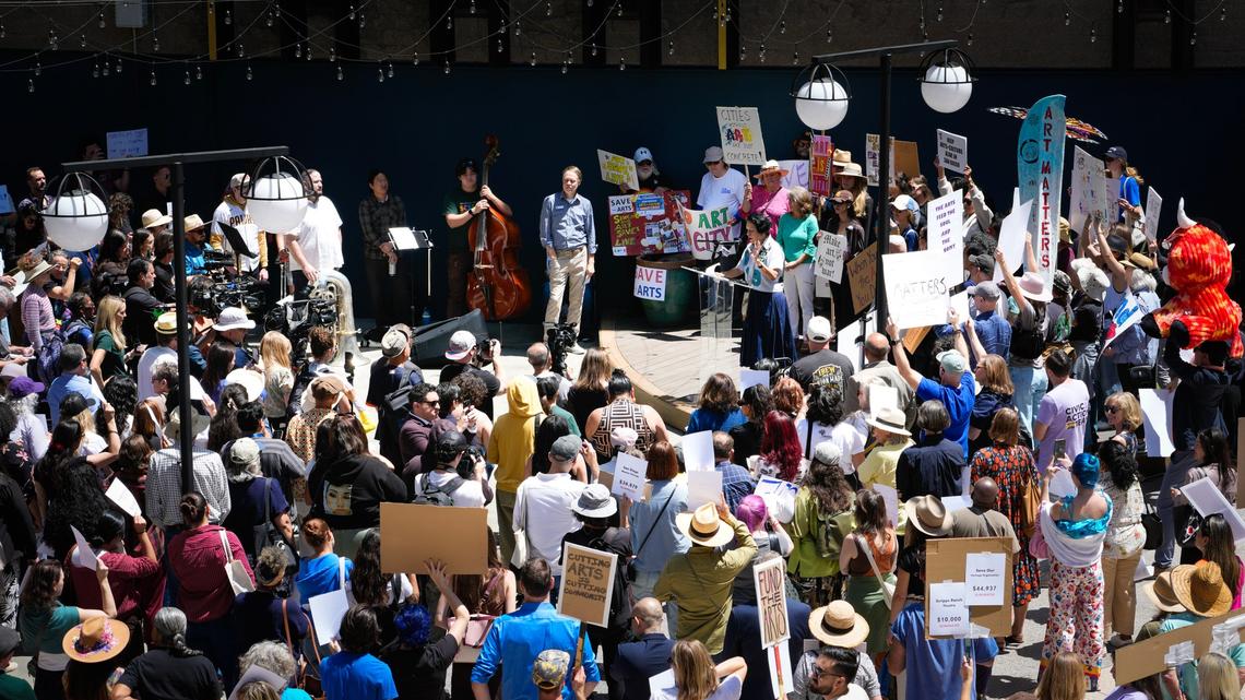 Hundreds of arts leaders and arts supporters  from artists to symphony musicians  took part in a demonstration protesting Mayor Todd Gloria proposed arts funding cuts.(Nelvin C. Cepeda / The San Diego Union-Tribune)