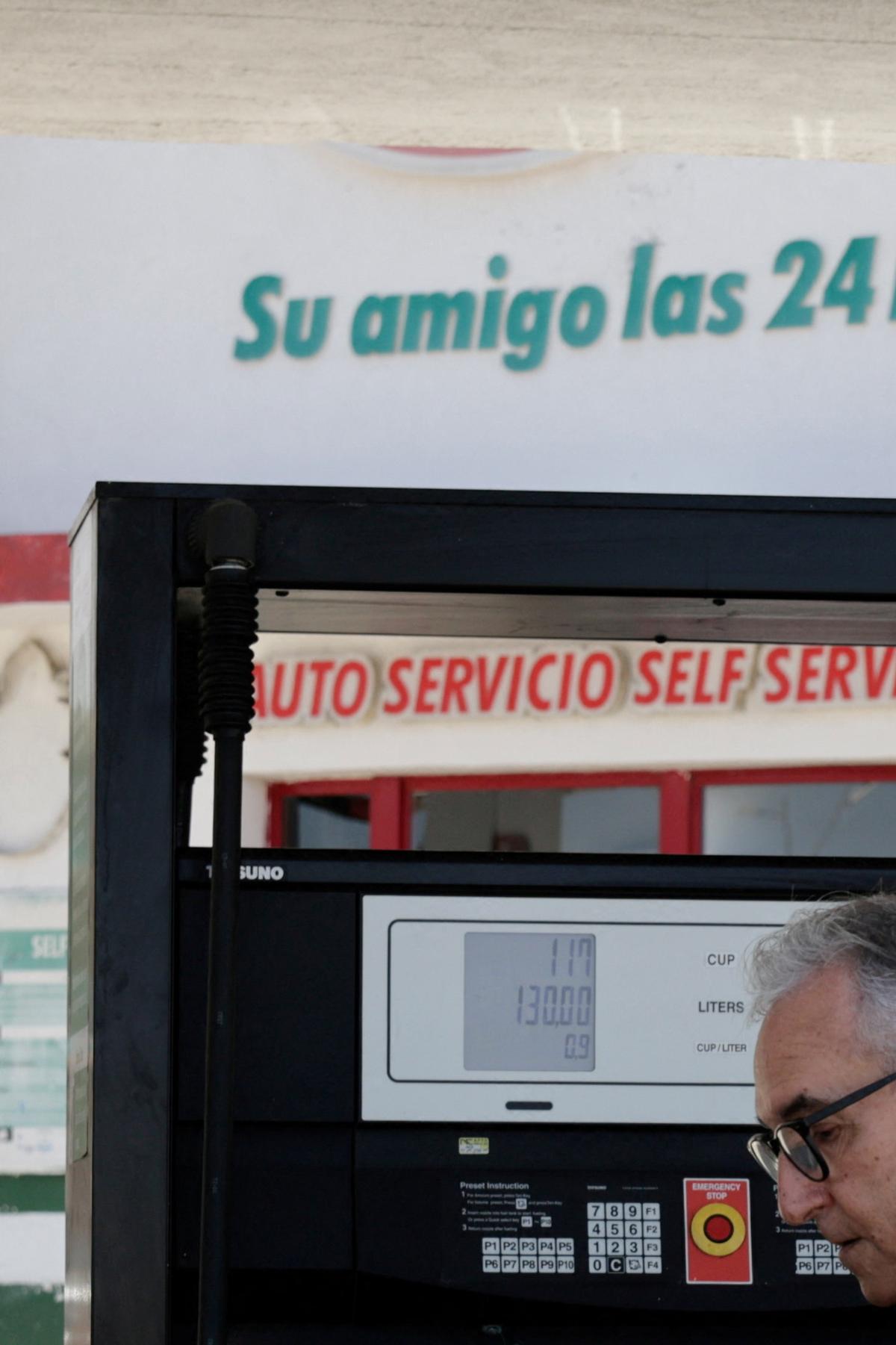 A driver fills up his tank as Cuba announces new and variable fuel prices at the pump beginning on May 15 to better reflect the actual costs of importing gas and diesel amid an ongoing U.S. fuel blockade, in Havana, Cuba, May 12, 2026. REUTERS/Norlys Perez