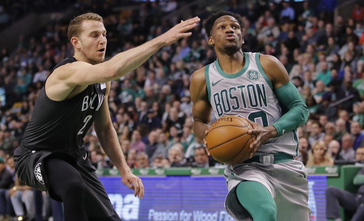 Apr 11, 2018; Boston, MA, USA; Boston Celtics guard Jonathan Gibson (60) controls the ball as Brooklyn Nets guard Nik Stauskas (2) defends in the first half at TD Garden. The Celtics defeated the Nets 110-97. Mandatory Credit: David Butler II-USA TODAY Sports