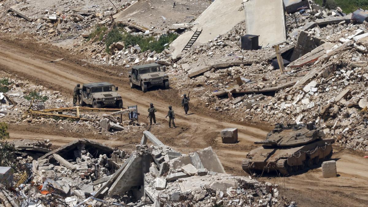 This photograph taken from the northern Israel shows Israeli tanks and military vehicles standing along the road between destroyed houses in southern Lebanon near the border with Israel, on April 29, 2026. Lebanon's army said on April 29 that one of its soldiers was among two people killed in an Israeli strike in the country's south, the latest deadly raid despite a ceasefire in the Israel-Hezbollah war. (Jalaa Marey/AFP/Getty Images/TNS)