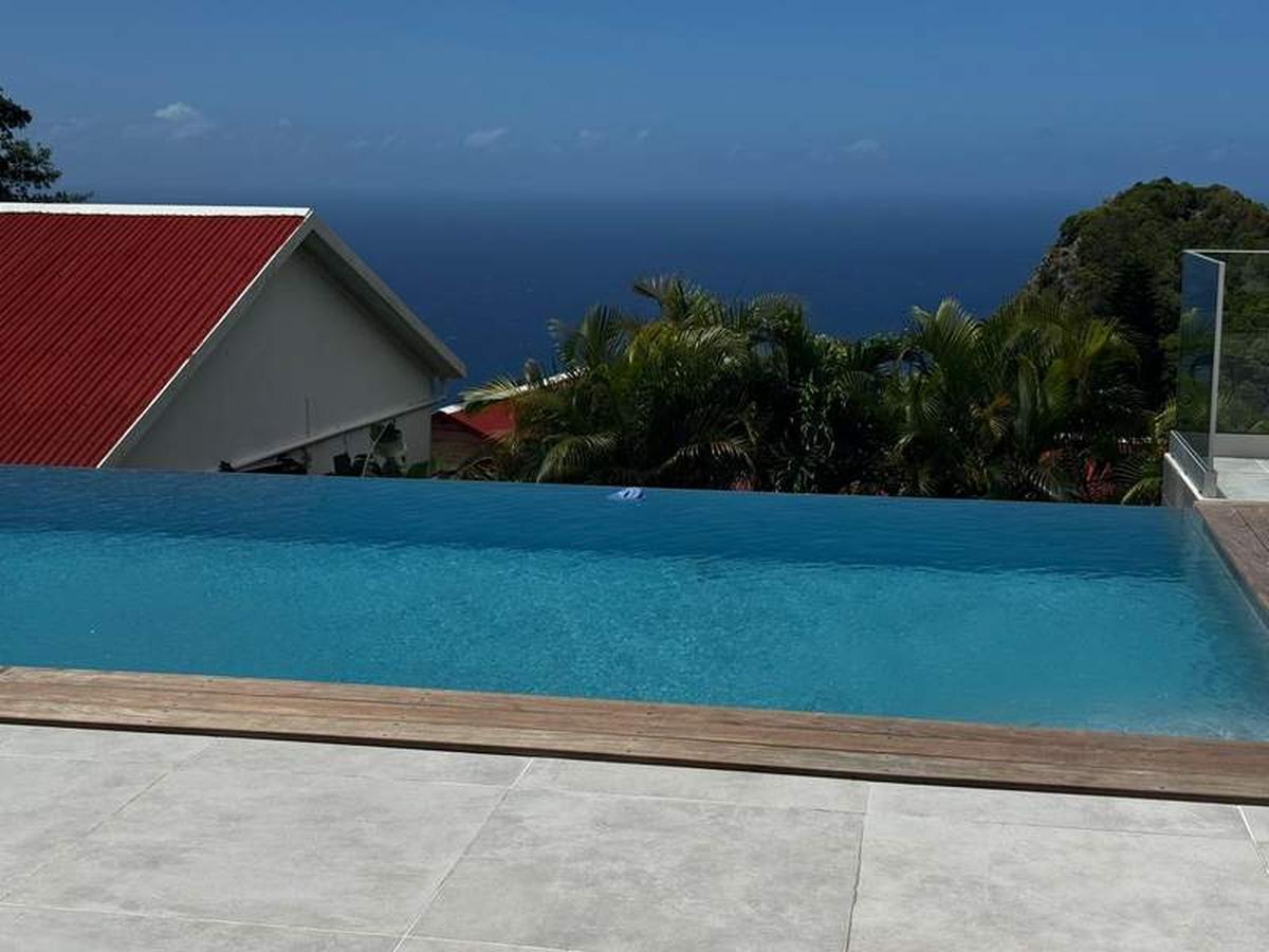  The Scenery Hotel's infinity pool stretches out toward the Caribbean Sea beyond. Photo credit: Emily Molina 