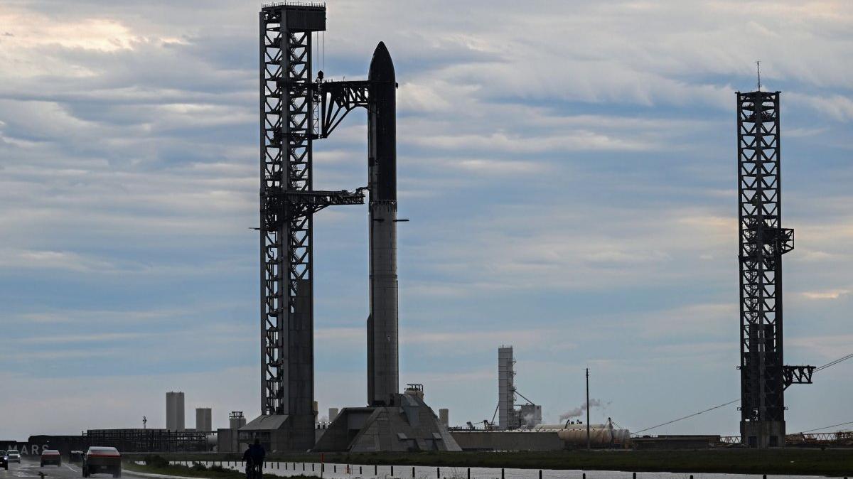 Under stormy skies, the SpaceX Super Heavy V3 booster and Starship spacecraft stand on Orbital Launch Pad 2 at Starbase, Texas, on Thursday ahead of a test launch, which has a launch window set to open at 6:30 p.m. EDT. Photo by Joe Marino/UPI