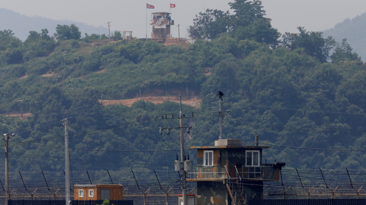 FILE PHOTO: A North Korean soldier stands guard at his guard post inside North Korean territory, in this picture taken from Paju, South Korea, near the demilitarized zone (DMZ) separating the two Koreas, June 17, 2020.   REUTERS/Kim Hong-Ji/File Photo