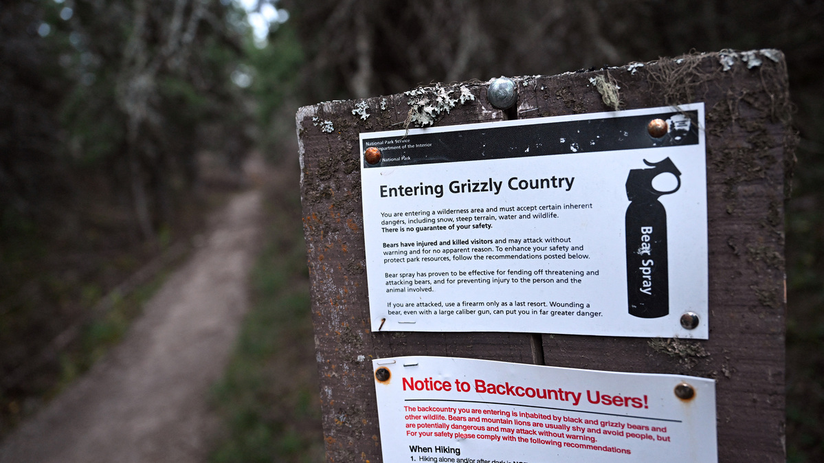 A sign warns against bears on the Grinnell Glacier trail in Glacier National Park, Montana, on Oct.19, 2023. (Josh Edelson/AFP/Getty Images/TNS)