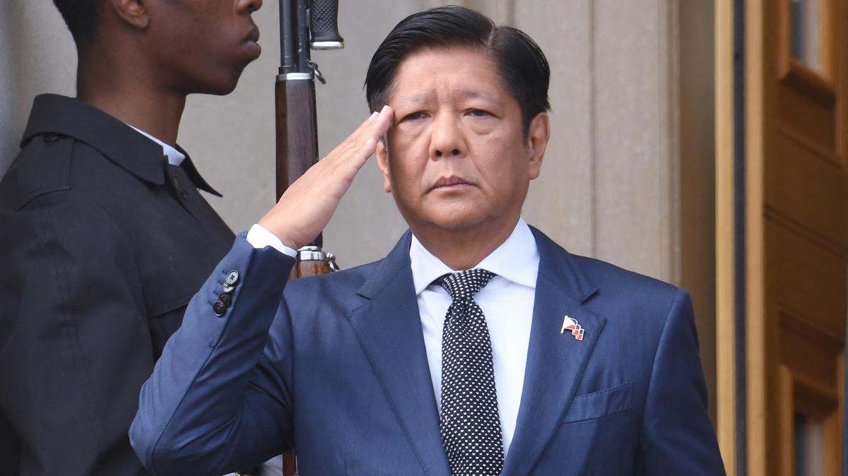 Philippines President Ferdinand Marcos Jr., salutes during a welcome ceremony at the Pentagon in Washington, D.C., on April 12, 2024. (Olivier Douliery/AFP/Getty Images/TNS)