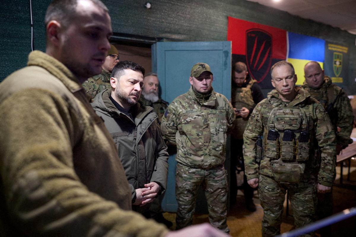 FILE PHOTO: Ukrainian President Volodymyr Zelenskiy, deputy head of his office Brigadier General Pavlo Palisa and Commander in Chief of the Ukrainian Armed Forces General Oleksandr Syrskyi visit a position of Ukrainian service members in the front line, amid Russia's attack on Ukraine, in Donetsk region, Ukraine March 6, 2026. Ukrainian Presidential Press Service/Handout via REUTERS/File Photo