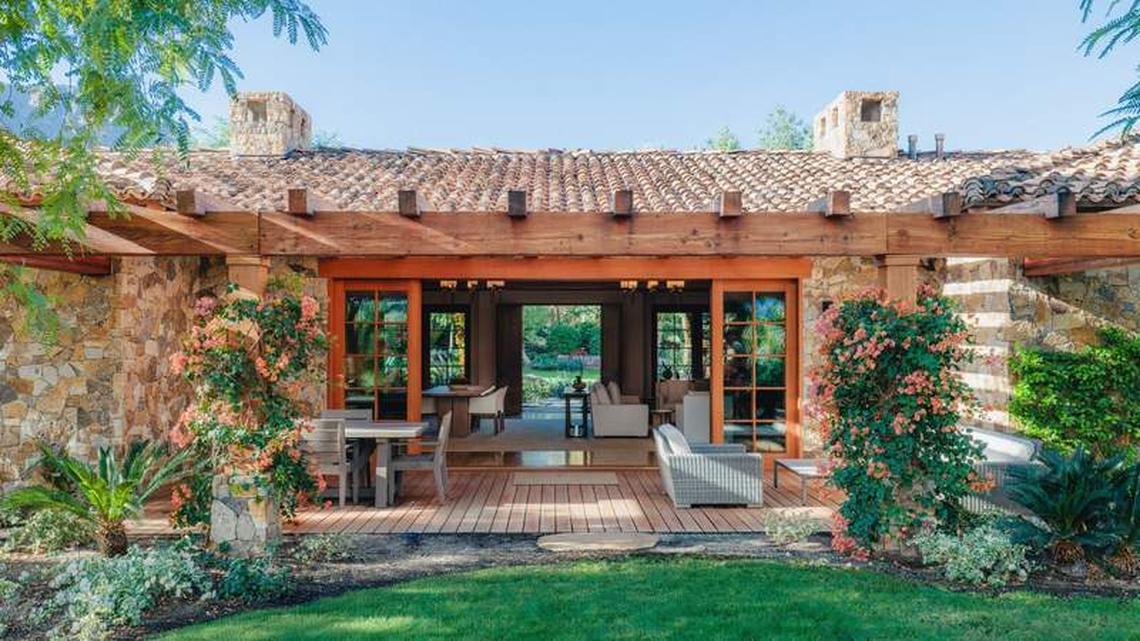  Sensei Retreat Palm Springs outdoor bungalow with doors that open to green gardens and flowers. Photo credit: Tanveer Badal 