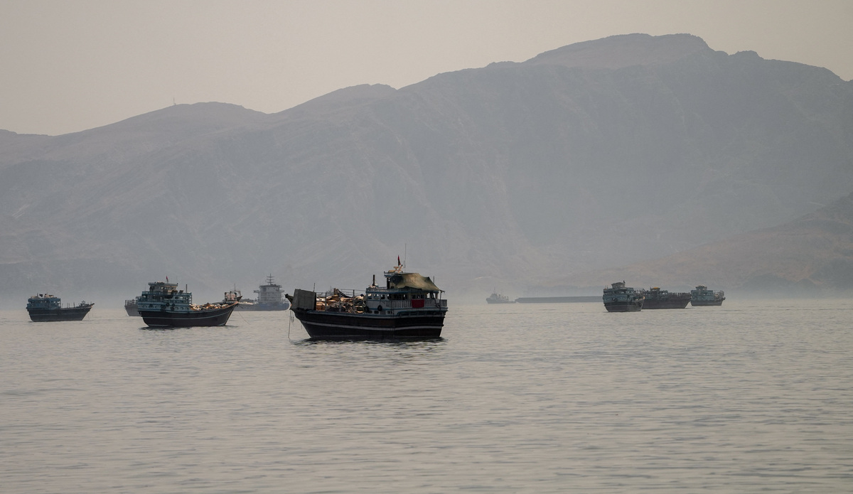 Vessels are anchored in the Strait of Hormuz, as seen from Musandam, Oman, June 19, 2026.