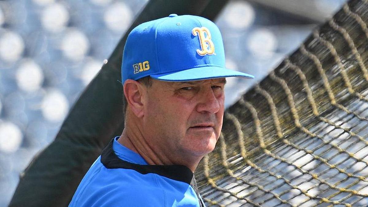  Jun 14, 2025; Omaha, Neb, USA; UCLA Bruins head coach John Savage watches the team warm up before the game against the Murray State Races at Charles Schwab Field. Mandatory Credit: Steven Branscombe-Imagn Images | Steven Branscombe-Imagn Images 