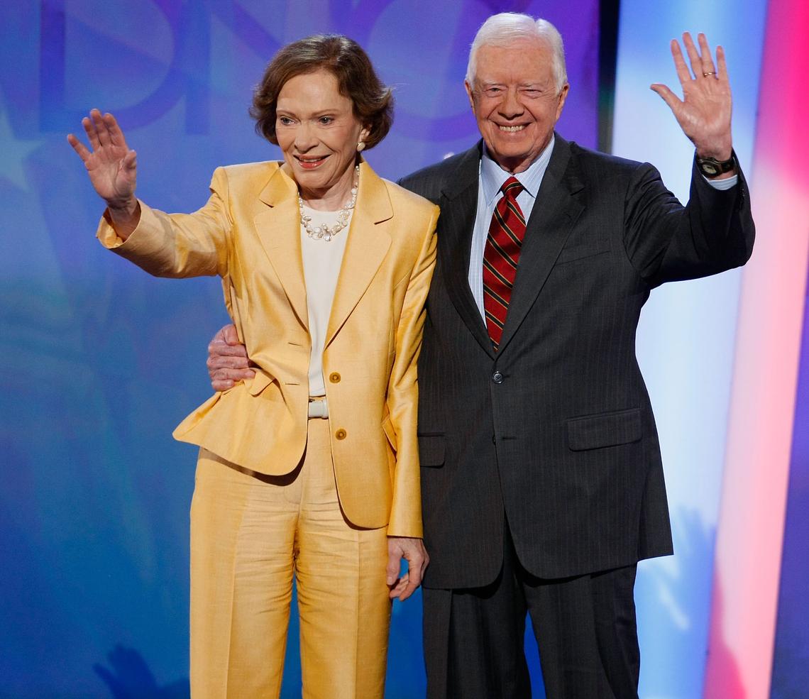DENVER - AUGUST 25: Former U.S. President Jimmy Carter (R) and former first lady Rosalynn Carter wave on stage during day one of the Democratic National Convention (DNC) at the Pepsi Center August 25, 2008 in Denver, Colorado. The DNC, where U.S. Sen. Barack Obama (D-IL) will be officially nominated as the Democratic candidate for U.S. president, starts today and finishes August 28th.  (Photo by Mark Wilson/Getty Images)