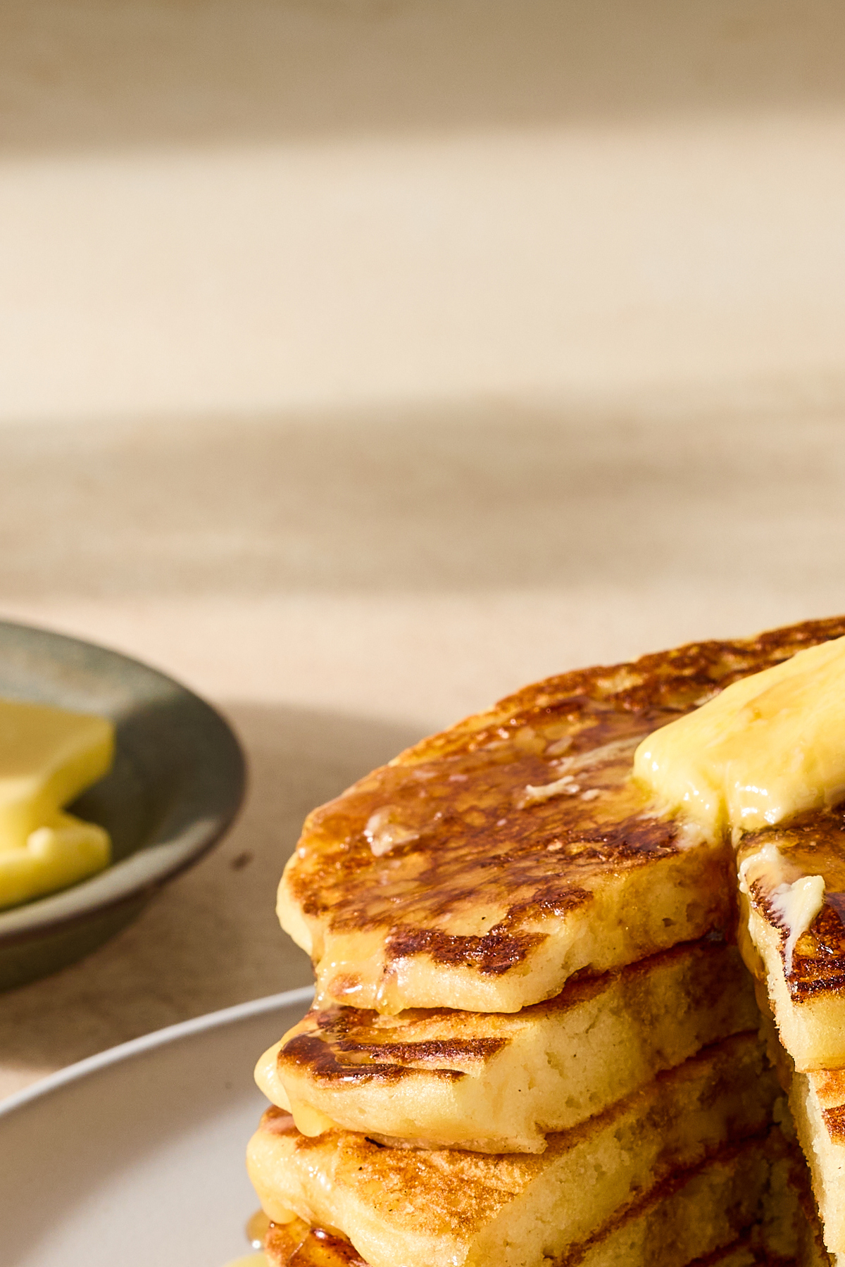 A golden stack of pancakes, slicked with butter, dripping with syrup, is one of the most rewarding breakfasts you can cook on a weekend -- a perfect way to start the day. Food Stylist: Monica Pierini. (Julia Gartland/The New York Times)