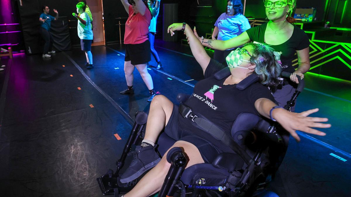 Hayley Treen has a number of physical challenges, but she still loves to dance. Instructor Sarah Briscoe helps her do so at the Chance 2 Dance studio in Maitland on Monday, May 4. Students were preparing for a showcase to celebrate the nonprofit’s 10th anniversary. (Joe Burbank/Orlando Sentinel)