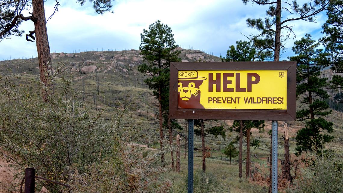 A U.S. Forest Service sign with Smokey Bear in the Rocky Mountains of Colorado. The agency is poised to shutter 57 research stations in 31 states. (Brad Sauter/Dreamstime/TNS)
