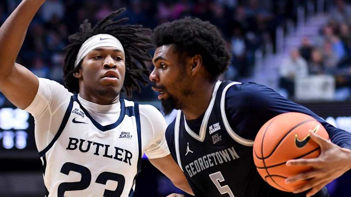  Jan 31, 2026; Indianapolis, Indiana, USA; Georgetown Hoyas guard KJ Lewis (5) drives against Butler Bulldogs guard Azavier Robinson (23) during the second half at Hinkle Fieldhouse. Mandatory Credit: Robert Goddin-Imagn Images | Robert Goddin-Imagn Images 