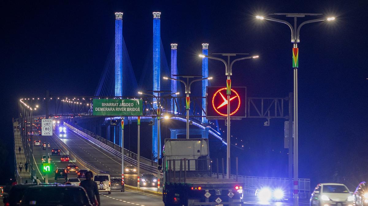 Traffic flows over the Bharrat Jagdeo Demerara River Bridge, which was inaugurated in 2025 in Georgetown, Guyana. Guyana's fast-growing economy is set to benefit from a reshaped global energy market due to the U.S.-Israeli war on Iran.