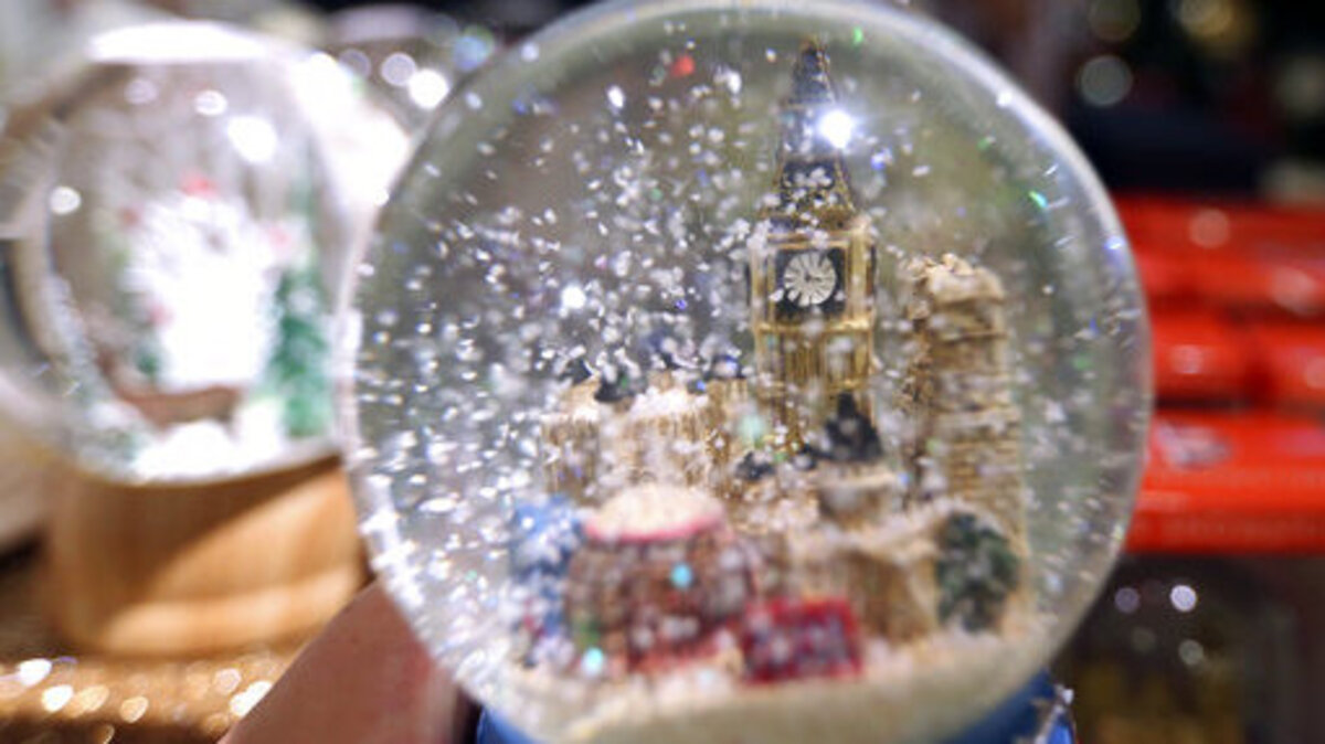 A snow globe features in a Christmas display in Selfridges in London, Monday Aug. 6, 2018.