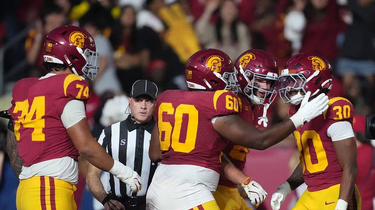  Nov 29, 2025; Los Angeles, California, USA; Southern California Trojans running back King Miller (30) celebrates with offensive lineman Kaylon Miller (60) and offensive lineman Justin Tauanuu (74) after scoring on a 5-yard touchdown run against the UCLA Bruins in the first half at United Airlines Field at Los Angeles Memorial Coliseum. Mandatory Credit: Kirby Lee-Imagn Images | Kirby Lee-Imagn Images 
