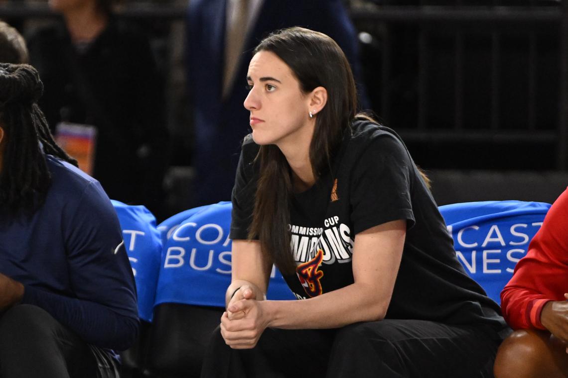  Indiana Fever guard Caitlin Clark (22) looks on from the bench during a game. Rafael Suanes-Imagn Images