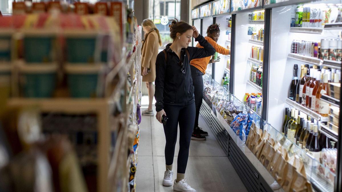Customers browse the refrigerated cases, April 21, 2022, at Foxtrot Market in Tribune Tower. (Brian Cassella/Chicago Tribune/TNS)