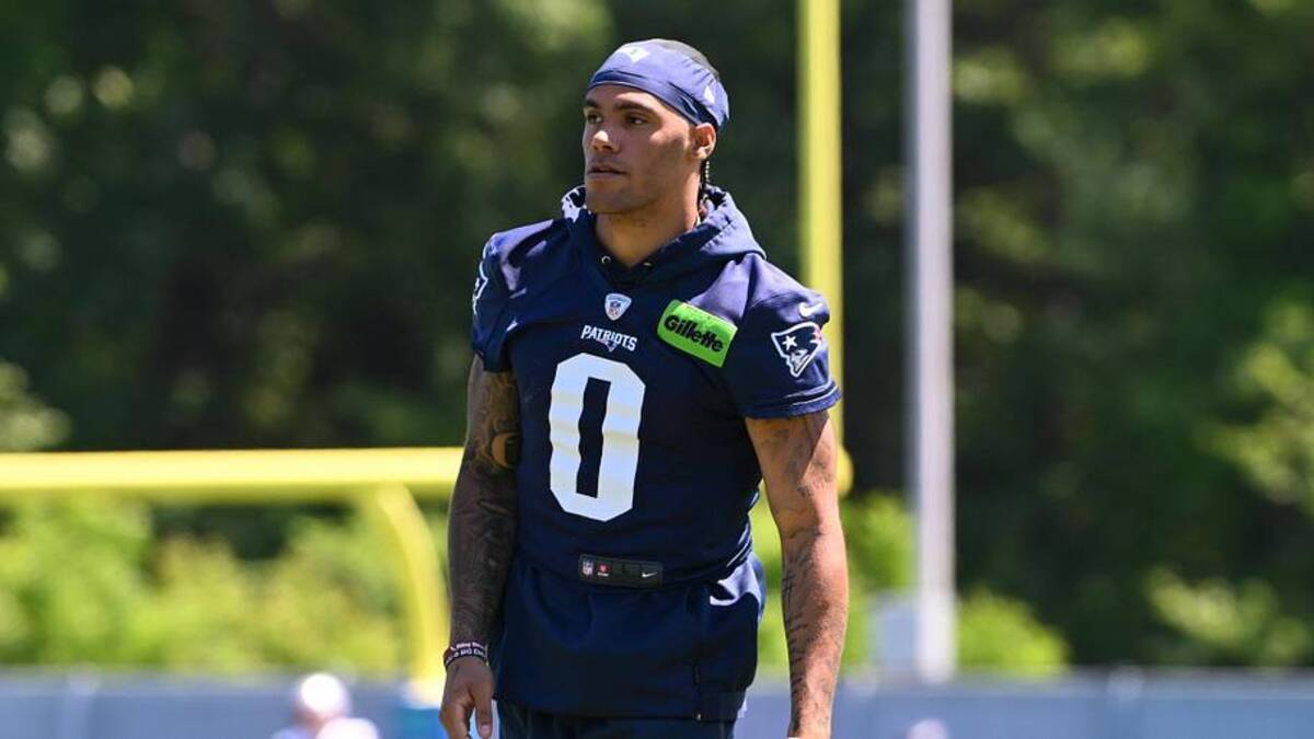  Jun 9, 2026; Foxborough, MA, USA; New England Patriots cornerback Christian Gonzalez (0) looks on before the start of drills at minicamp at Gillette Stadium. Mandatory Credit: Eric Canha-Imagn Images | Eric Canha-Imagn Images 
