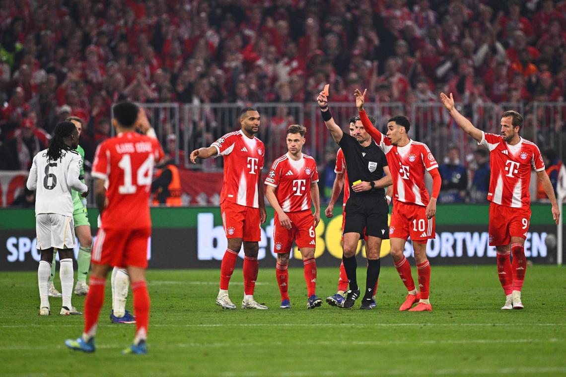  15 April 2026, Bavaria, Munich: Soccer, men: Champions League, Bayern Munich - Real Madrid, knockout round, quarter-finals, second leg, Allianz Arena, referee Slavko Vincic shows Eduardo Camavinga (l, Real Madrid) the red card. Photo: Tom Weller/dpa (Photo by Tom Weller/picture alliance via Getty Images) Photo by Tom Weller/picture alliance via Getty Images