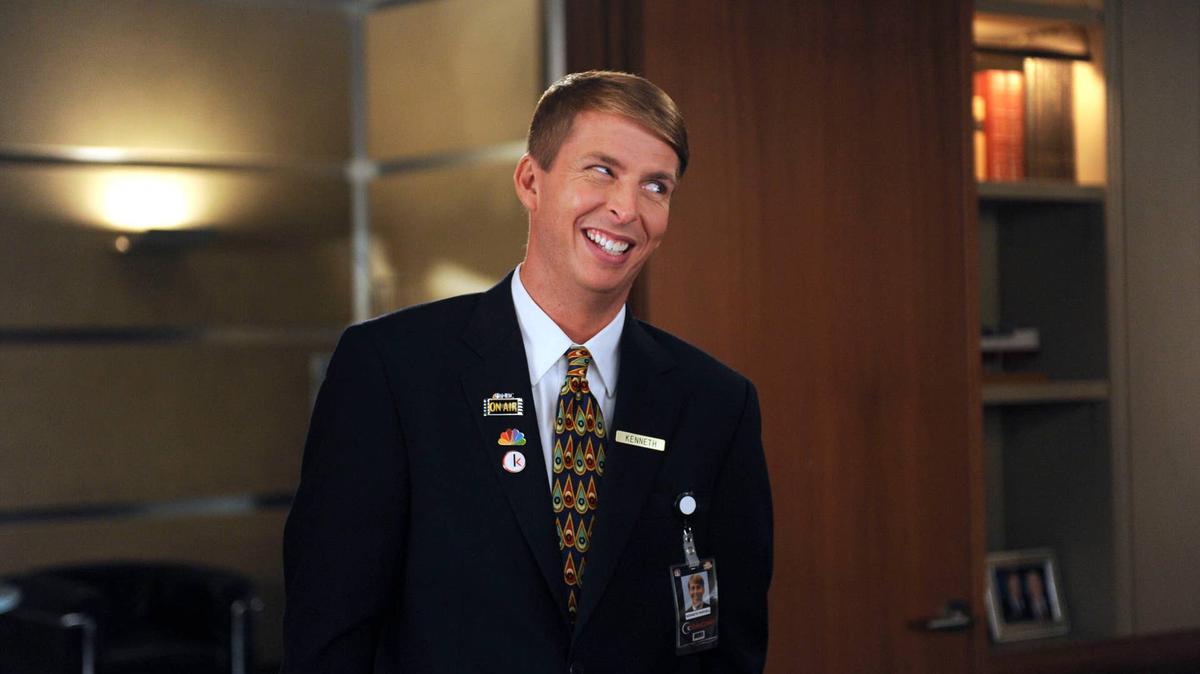 Jack McBrayer as Kenneth Parcell, smiling in a page uniform in 30 ROCK "Today You Are A Man" Episode 605. 