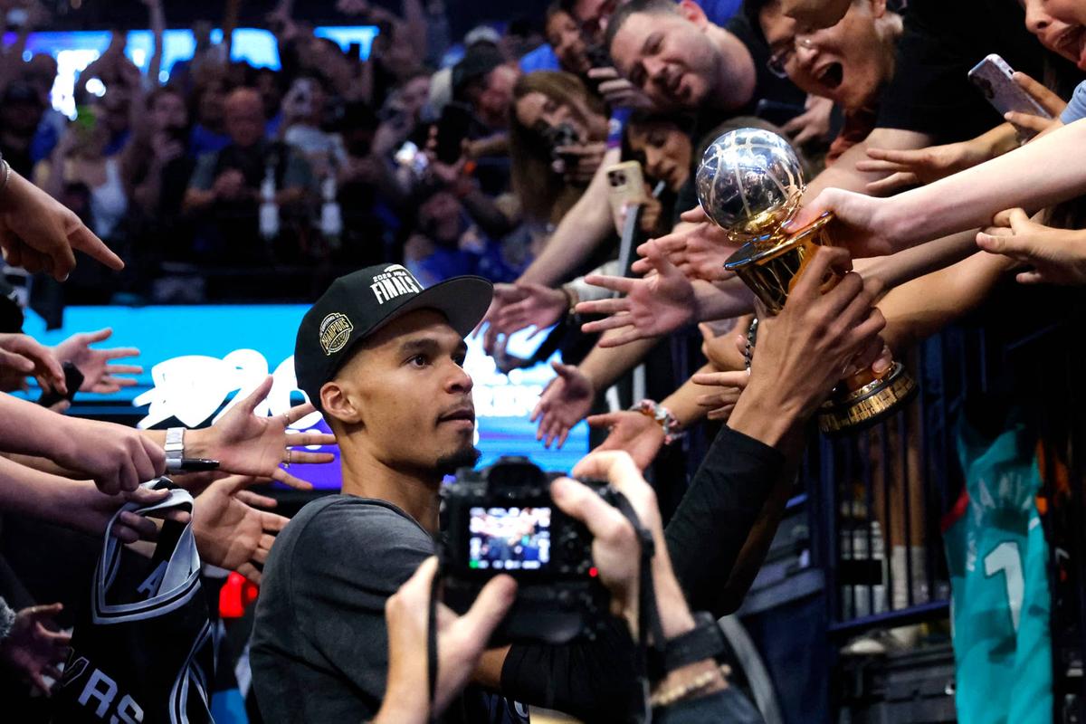  San Antonio Spurs forward Victor Wembanyama (1) celebrates with the MVP trophy 