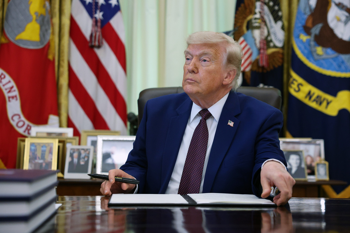  President Donald Trump prepares to sign an executive order in the Oval Office of the White House on June 3, 2026, in Washington. 