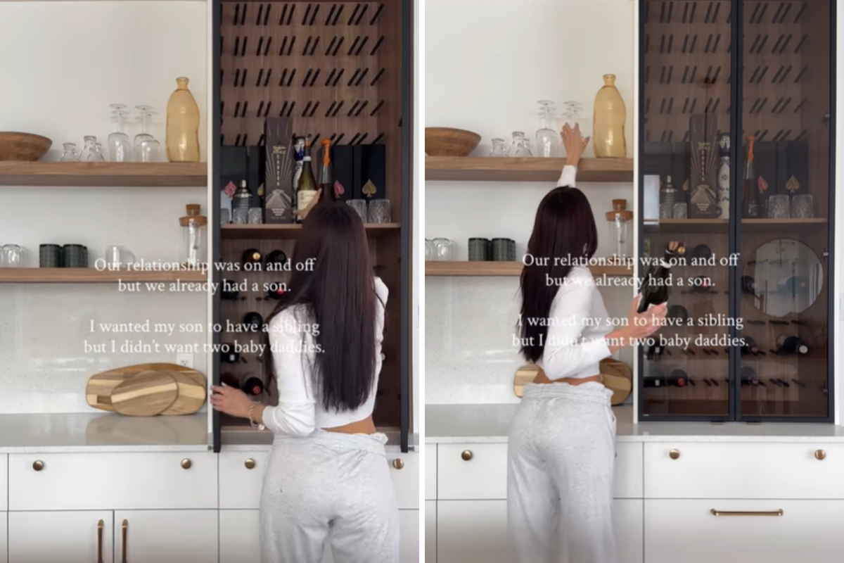  Sasha Goreshtein opening the fridge door and reaching up to a shelf in the kitchen. 