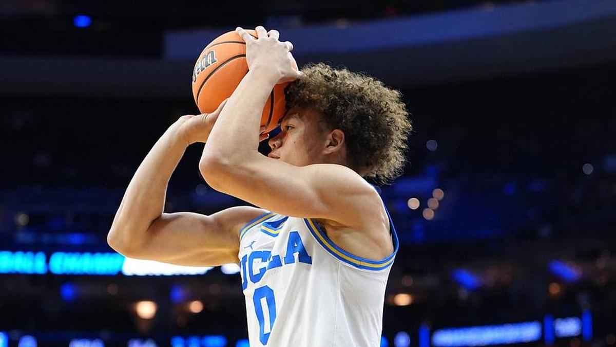  Mar 20, 2026; Philadelphia, PA, USA; UCLA Bruins guard Trent Perry (0) shoots the ball against the UCF Knights in the first half during a first round game of the men's 2026 NCAA Tournament at Xfinity Mobile Arena. Mandatory Credit: Kyle Ross-Imagn Images | Kyle Ross-Imagn Images 