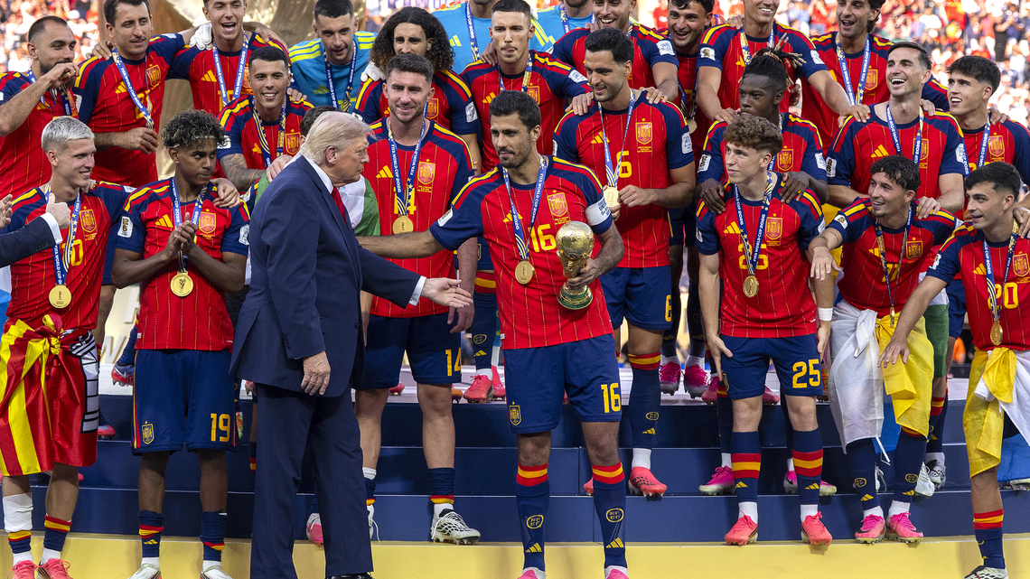Trump lingers awkwardly long after presenting World Cup trophy to Spain. It could have been worse. 