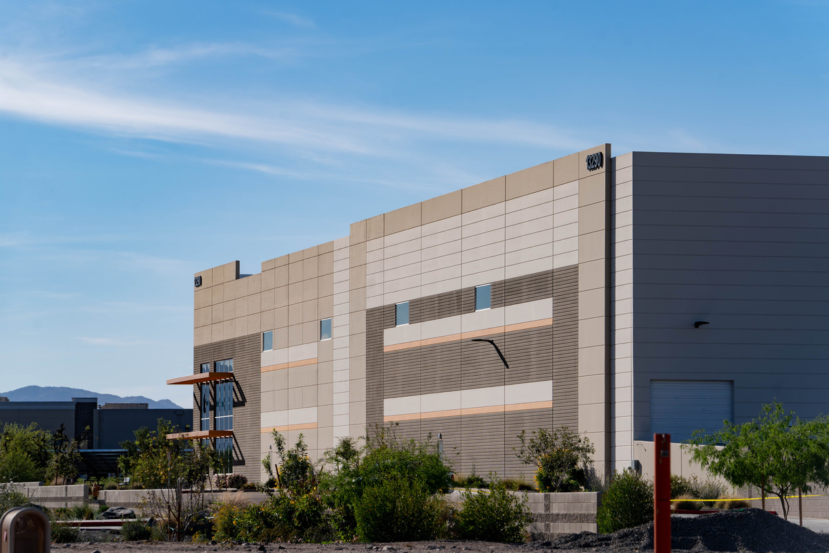 The exterior of a Surprise warehouse owned by DHS as local high school students gathered nearby March 13, 2026, to denounce a plan to use the structure as an ICE processing facility. The building, which would have 1,500 beds, sits about a mile from Dysart High School.