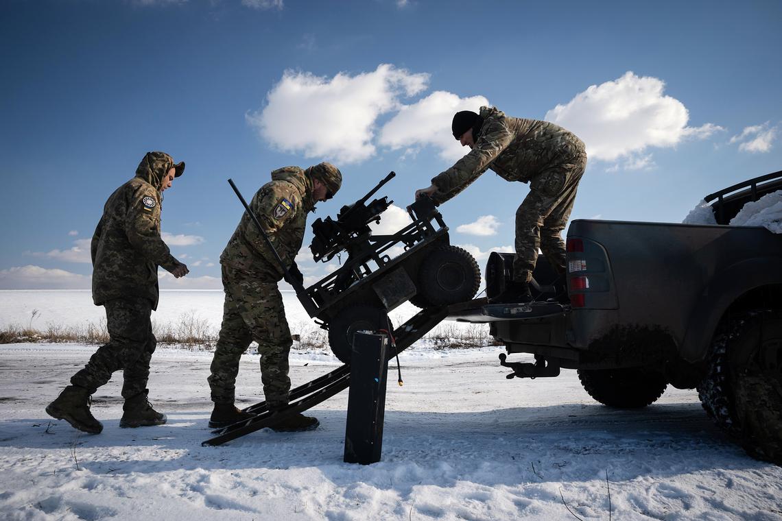 FILE -- Ukrainian soldiers train with an unmanned ground vehicle in the Donbas region of eastern Ukraine, Feb. 21, 2025. Ukraine is using unmanned ground vehicles armed with bombs, guns or rockets to carry out attacks and keep its soldiers out of harm's way. (Tyler Hicks/The New York Times)
