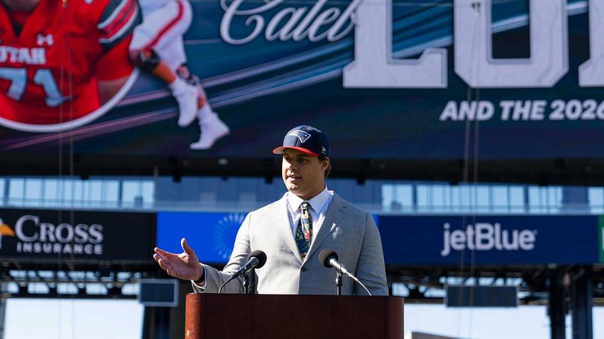  May 7, 2026; Foxborough, MA, USA; New England Patriots first round draft pick Caleb Lomu addresses the media during a press conference on the game field at Gillette Stadium. Mandatory Credit: Natalie Reid-Imagn Images | Natalie Reid-Imagn Images 