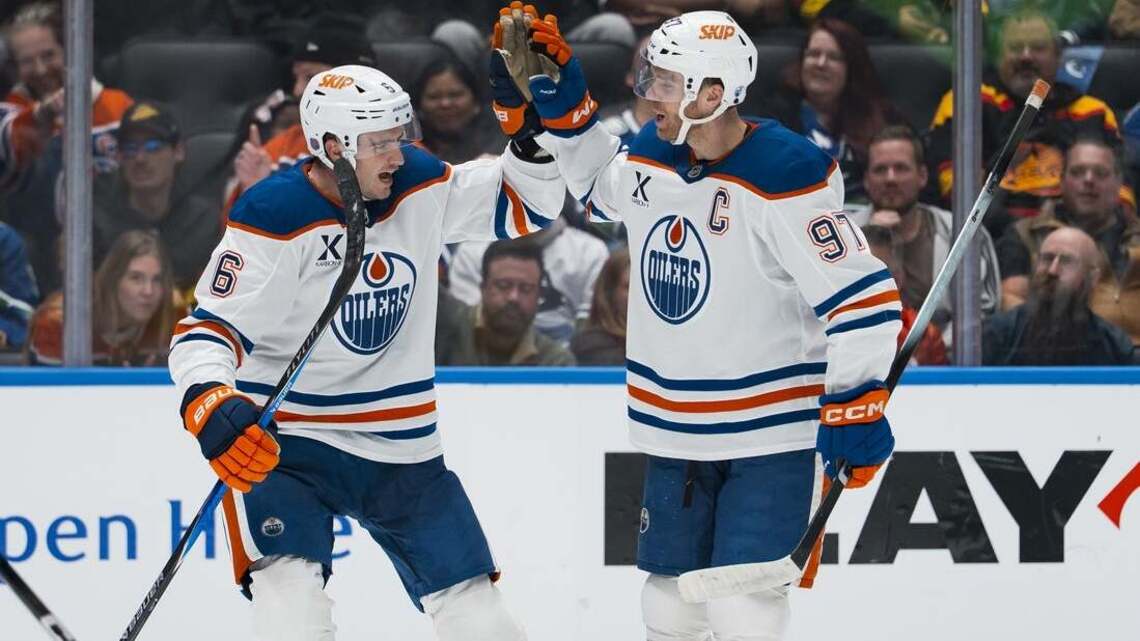 Evan Bouchard, Connor McDavid make waves as Oilers beat Canucks 9-7 