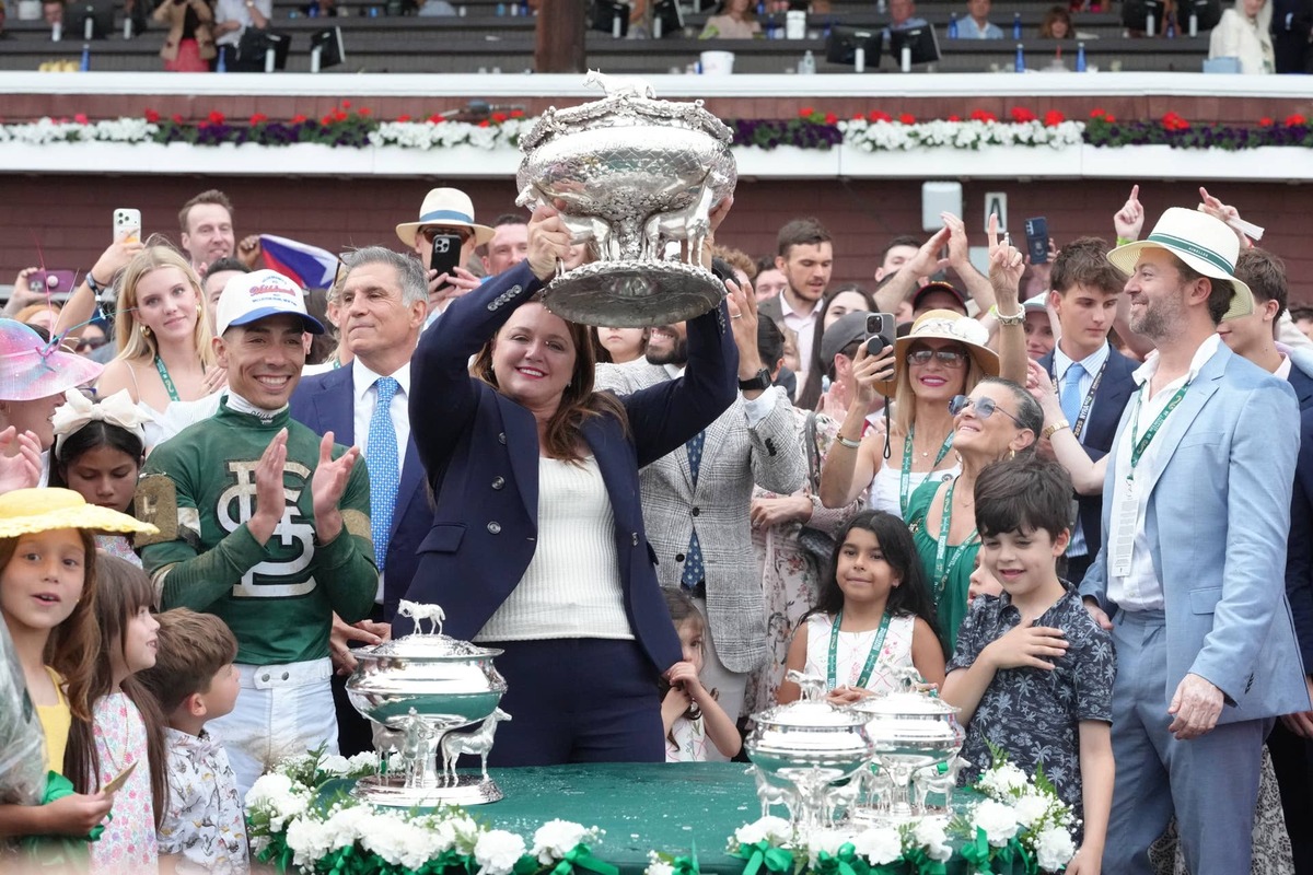  Trainer for Golden Tempo, Cherie DeVaux holds up the Belmont Stakes trophy after winning the Belmont Stakes at Saratoga Race Course. 