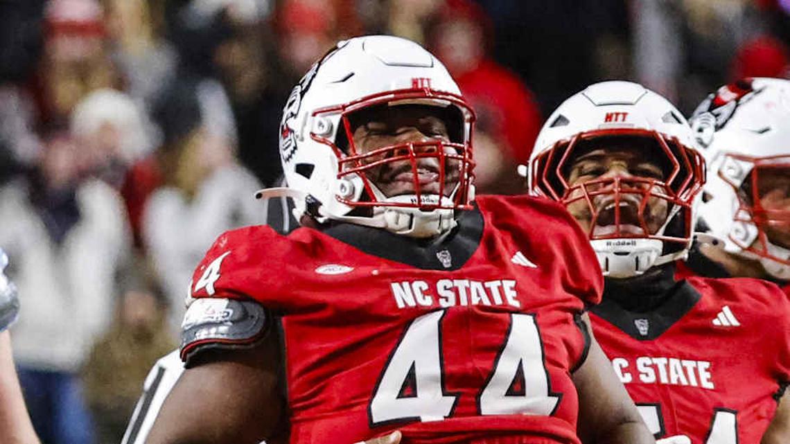  Nov 29, 2025; Raleigh, North Carolina, USA; NC State Wolfpack defensive tackle Brandon Cleveland (44) reacts to his tackle during the first half of the game against North Carolina Tar Heels at Carter-Finley Stadium. Mandatory Credit: Jaylynn Nash-Imagn Images | Jaylynn Nash-Imagn Images 