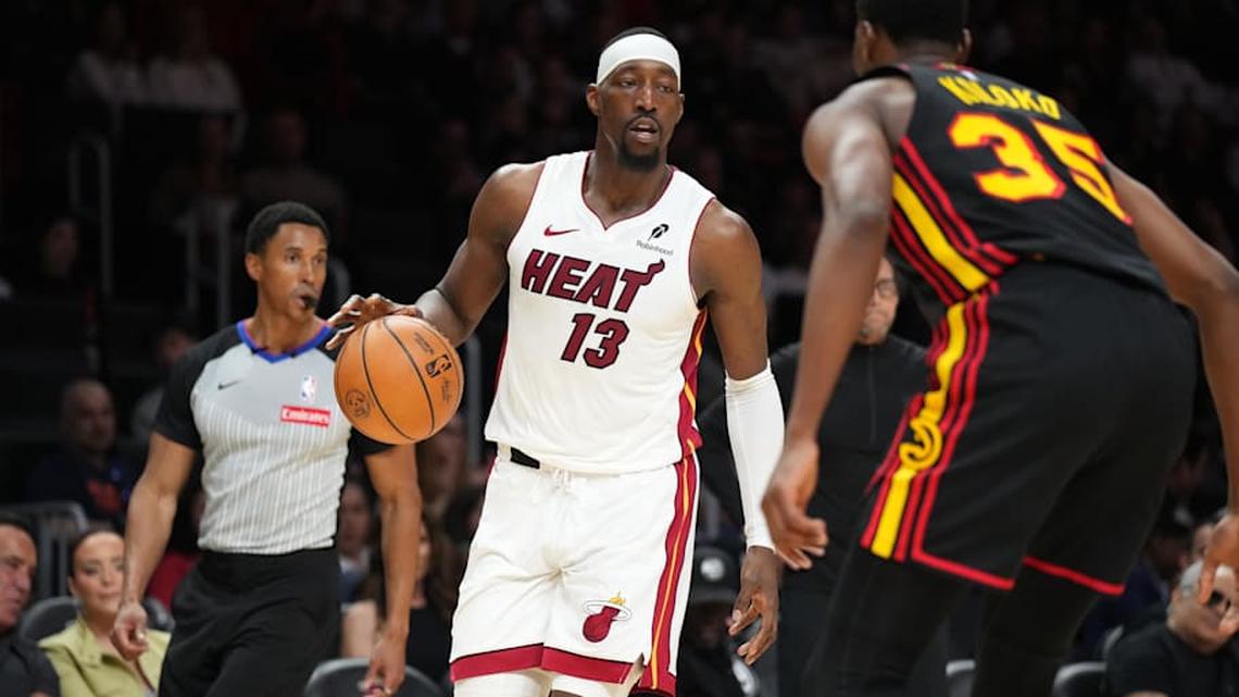  Apr 12, 2026; Miami, Florida, USA; Miami heat forward Bam Adebayo (13) dribbles against Atlanta Hawks center Christian Koloko (35) during the second half at Kaseya Center. Mandatory Credit: Jim Rassol-Imagn Images | Jim Rassol-Imagn Images 