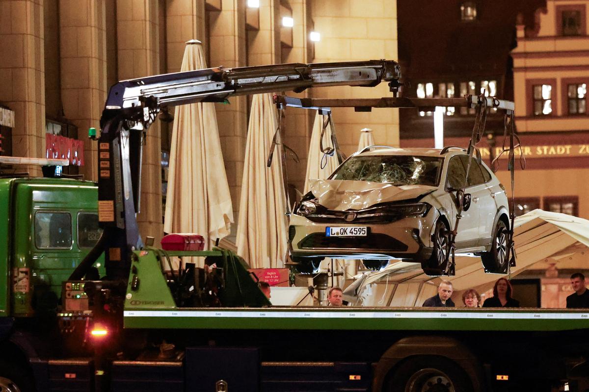 A car which drove into a group of people is lifted at the scene of a deadly incident, in Leipzig, Germany, May 5, 2026. REUTERS/Axel Schmid
