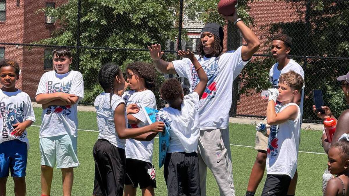  New England Patriots wide receiver Kyle Williams working with kids at his teammate's youth camp in Boston. | Ethan Hurwitz / Patriots On SI 