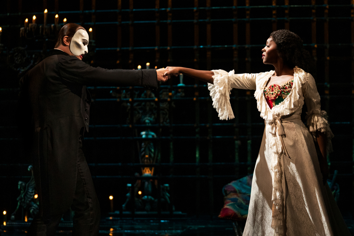 Ben Crawford as The Phantom and Emilie Kouatchou as Christine in “The Phantom of the Opera” on Broadway.
