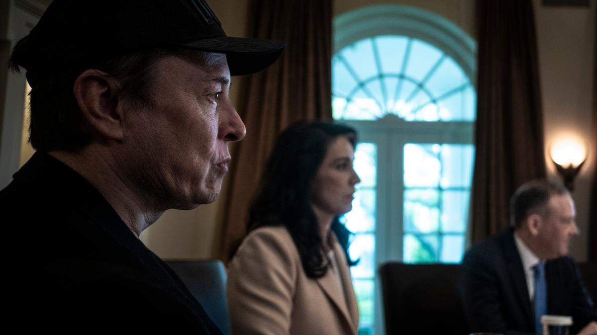 Elon Musk listens as President Donald Trump meets with his cabinet at the White House in Washington, on April 30, 2025.