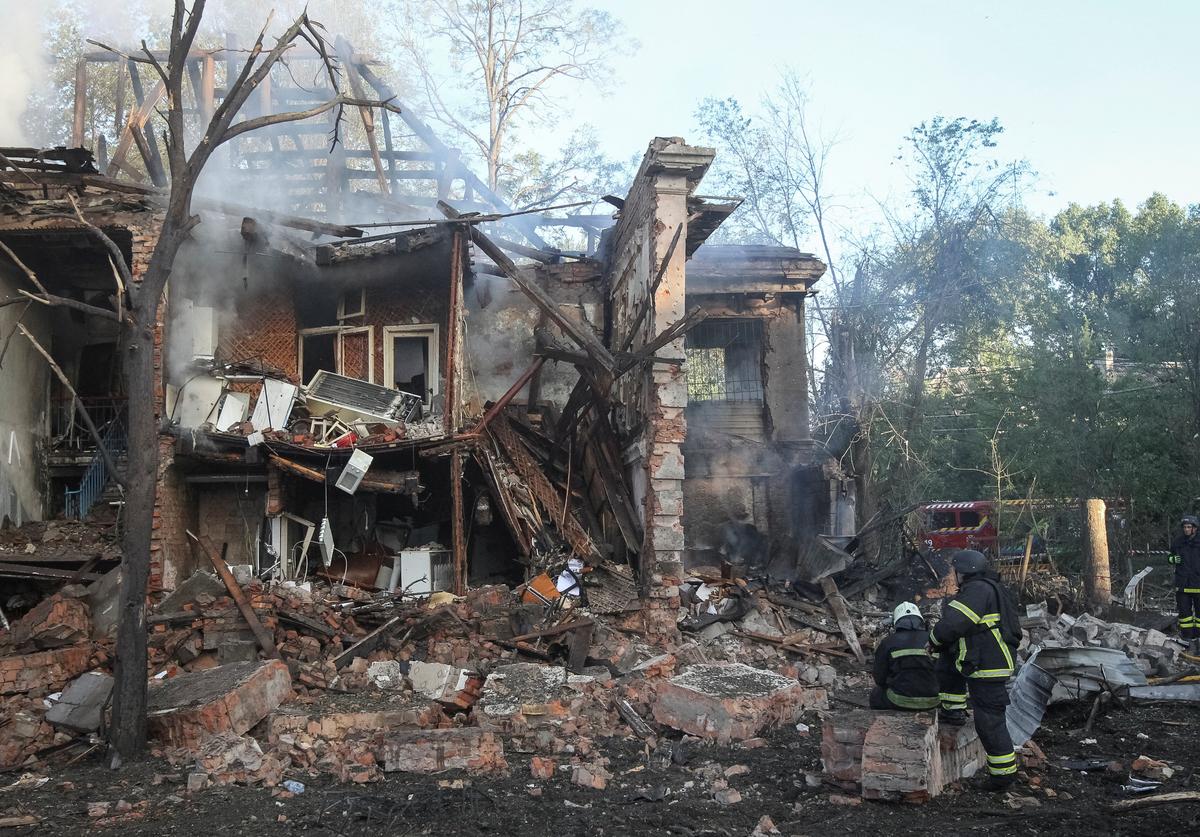 Firefighters rest at a site of an apartment building destroyed during a Russian drone and missile strike, amid Russia's attack on Ukraine, in Dnipro, Ukraine June 2, 2026. REUTERS/Stringer