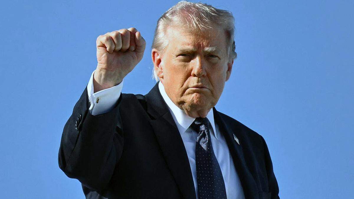 President Donald Trump gestures as he boards Air Force One before departing Palm Beach International Airport in West Palm Beach, Florida, on March 1, 2026, on his way back to Washington, D.C. The United States and Israel launched massive bombardments against Iran and killed its supreme leader on Feb. 28. (Mandel Ngan/AFP/Getty Images/TNS)