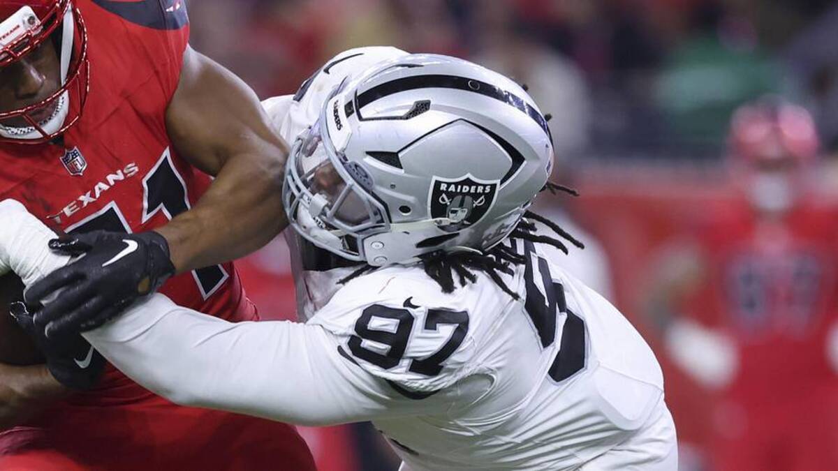  Dec 21, 2025; Houston, Texas, USA; Houston Texans running back Nick Chubb (21) runs with the ball as Las Vegas Raiders defensive tackle Tonka Hemingway (97) makes a tackle during the fourth quarter at NRG Stadium. Mandatory Credit: Troy Taormina-Imagn Images | Troy Taormina-Imagn Images 