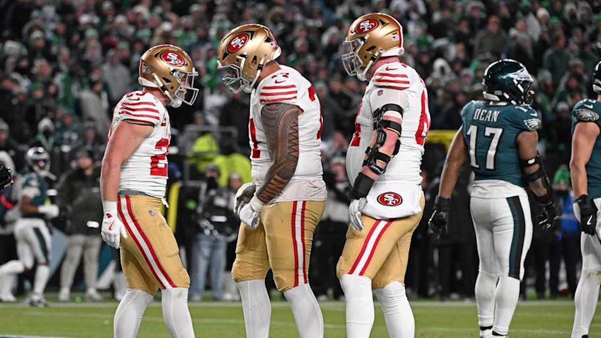  Jan 11, 2026; Philadelphia, PA, USA; San Francisco 49ers running back Christian McCaffrey (23) celebrates his touchdown with guard Dominick Puni (77) and center Jake Brendel (64) during the fourth quarter against the Philadelphia Eagles in an NFC Wild Card Round game at Lincoln Financial Field. Mandatory Credit: Eric Hartline-Imagn Images | Eric Hartline-Imagn Images 