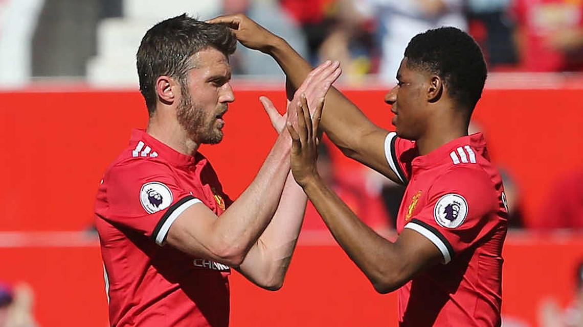  Michael Carrick (left) and Marcus Rashford overlapped at Man Utd. | John Peters/Manchester United/Getty Images 