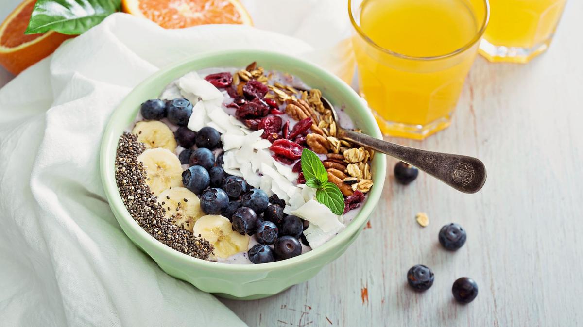 Breakfast smoothie bowl with fruits and granola