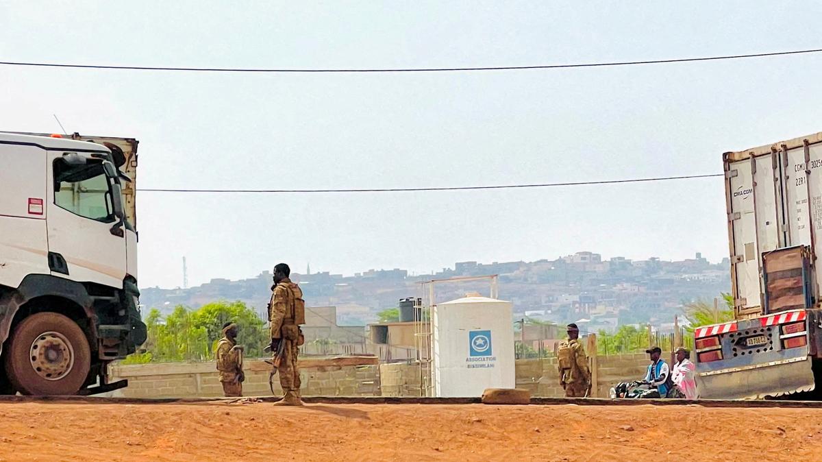 FILE PHOTO: Malian soldiers stand near a truck during a patrol following the attack on Mali's main military base Kati, outside the capital Bamako, in Kati, Mali, April 27, 2026. Picture taken with a mobile phone.   REUTERS/Stringer/File Photo