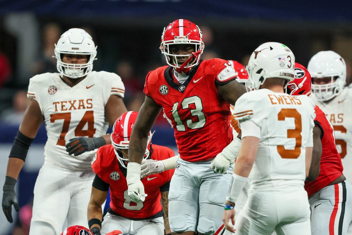 Georgia defensive lineman Mykel Williams (13) reacts after making a tackle as Texas quarterback Quinn Ewers (3) is shown on the play during the 2024 SEC Championship game at Mercedes-Benz Stadium, Saturday, December 7, 2024, in Atlanta.